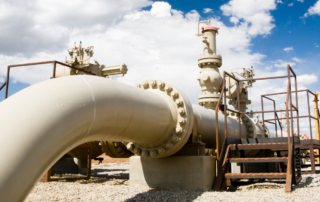 a large white pipe with a blue sky in the background.